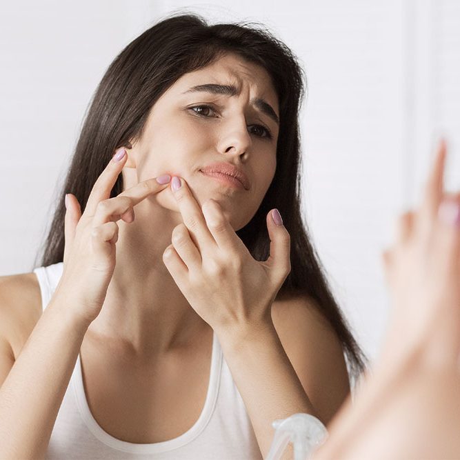 Side View Of A Young Businesswoman Suffering From Back Pain In O