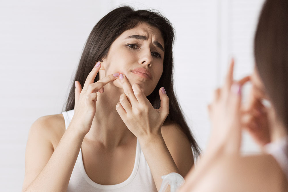 Side View Of A Young Businesswoman Suffering From Back Pain In O