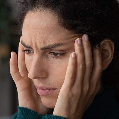 Young,Businesswoman,Doing,Exercises,At,Workplace,To,Relieve,Tired,Of