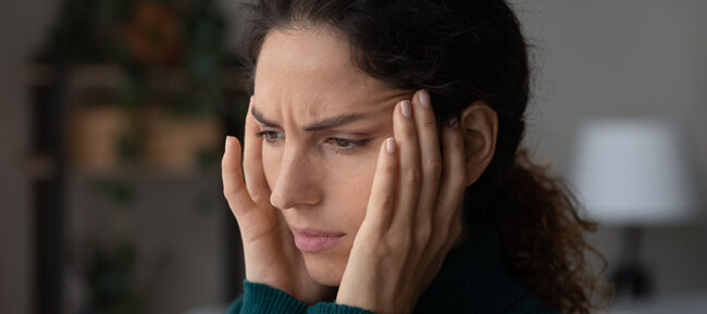 Young,Businesswoman,Doing,Exercises,At,Workplace,To,Relieve,Tired,Of